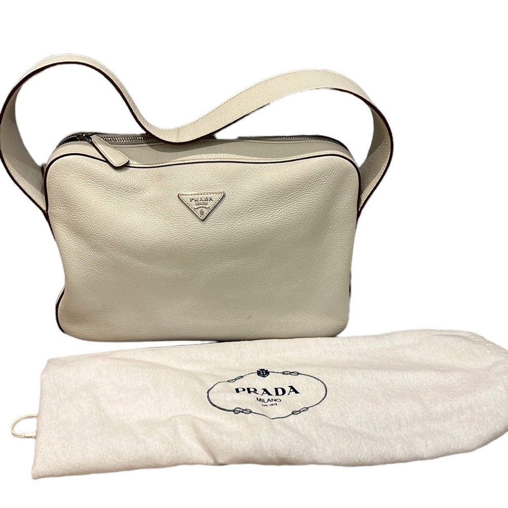 Authentic off-white leather Prada bag. Gently loved! Comes with dust bag.
